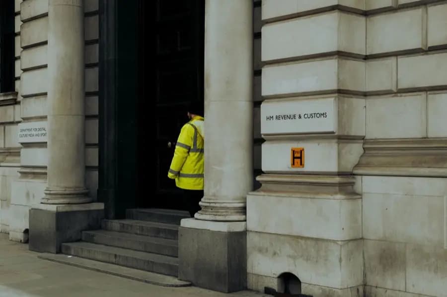 A security officer at the entrance of a government building in Whitehall, London